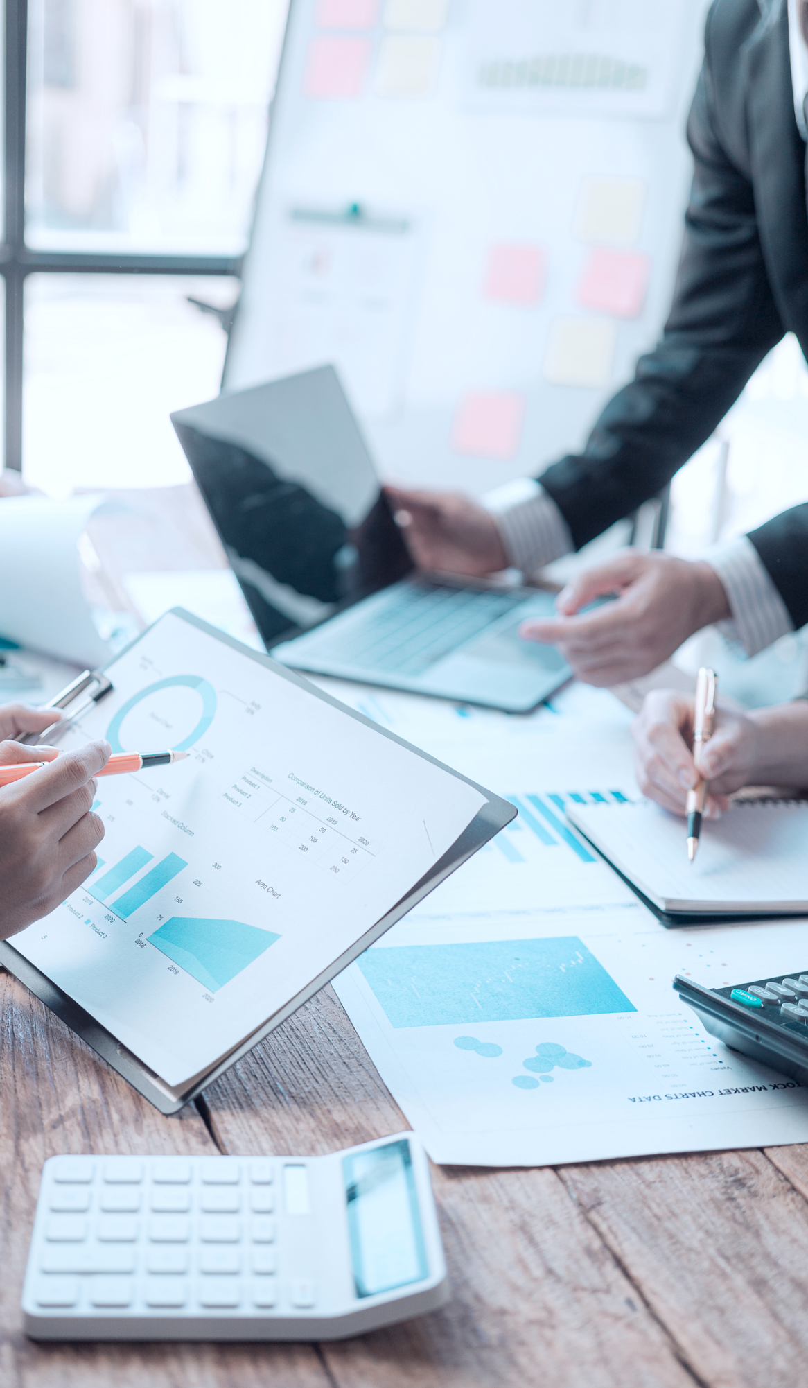 People reviewing charts and graphs